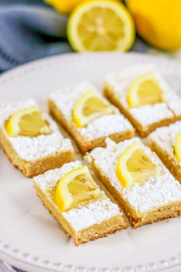 Keto Lemon Bars are a great way to treat the whole family without worrying about the repercussions. These dessert bars are great for anyone living on a low-carb or Keto Diet. #KetoDesserts #LowCarbDesserets