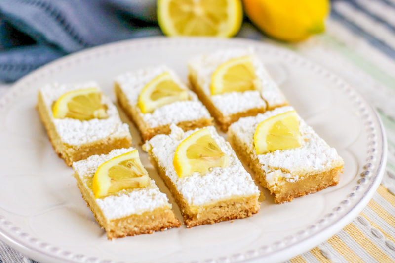 Keto Lemon Bars are a great way to treat the whole family without worrying about the repercussions. These dessert bars are great for anyone living on a low-carb or Keto Diet. #KetoDesserts #LowCarbDesserets