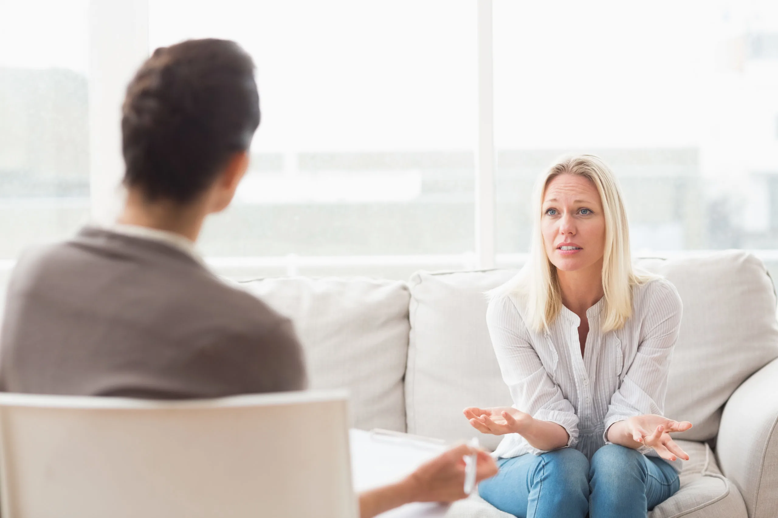 Woman asking questions to therapist