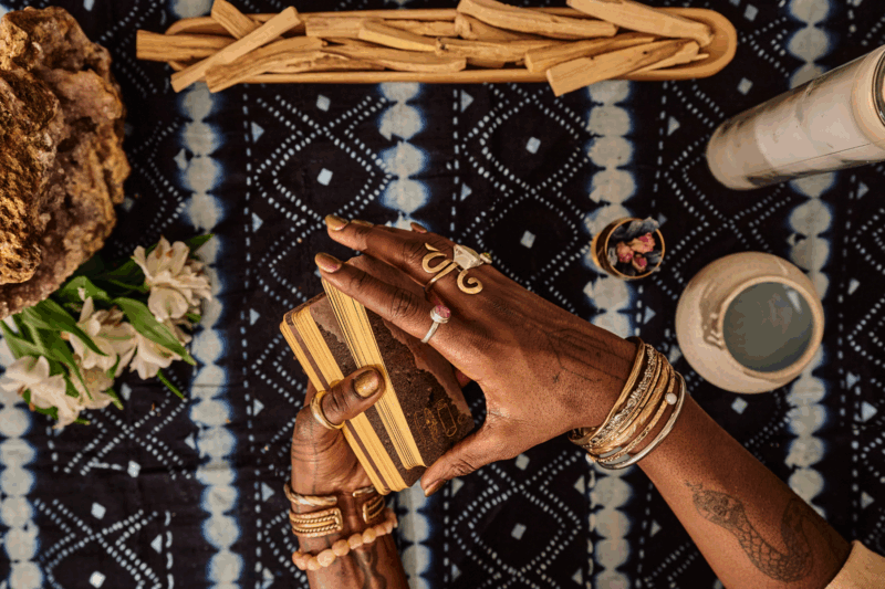 woman holding tarot deck