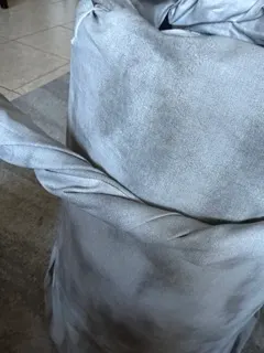 wrapping stormy fabric around laundry basket for homemade tornado costume