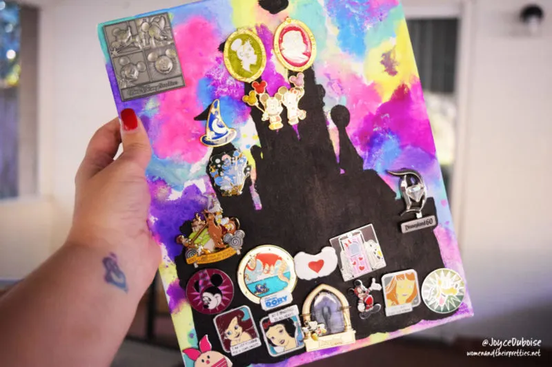 Disney DIY Pinboard: Use this easy tutorial to make a colorful Disney pinboard with paint, water, and a canvas. Display your Disney pins with pride!