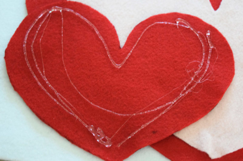 Cupid's Shot at Love is a DIY Valentine's Day game for kids (or adults) of any age to play! It's a cheap and easy to make Valentine's Day craft!